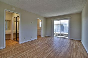 Bright living room with hardwood style floors 
